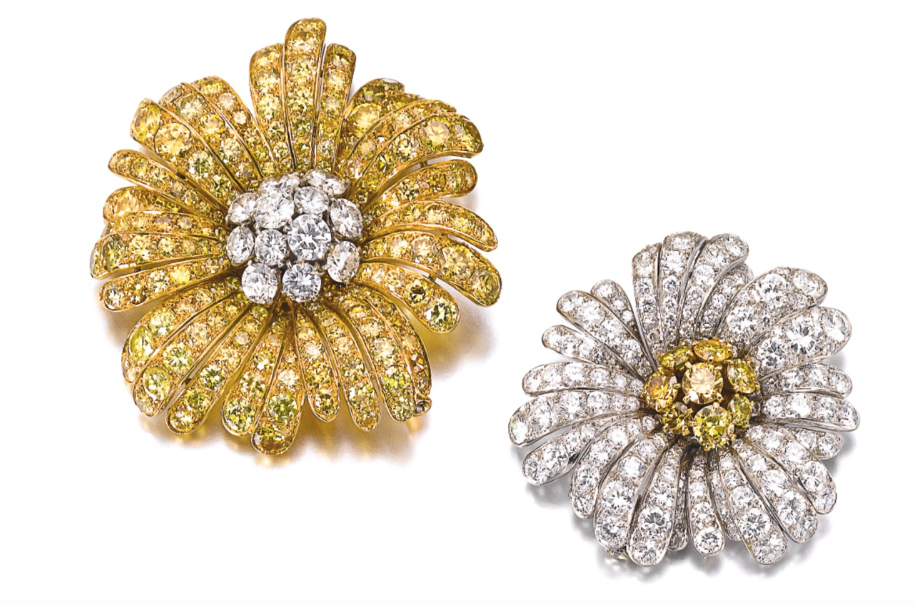 Van Cleef & Arpels brooches in three-dimensional daisy motifs, each set with brilliant-cut diamonds of yellow tint and similarly cut near colorless diamonds, (Courtesy of Sotheby’s)