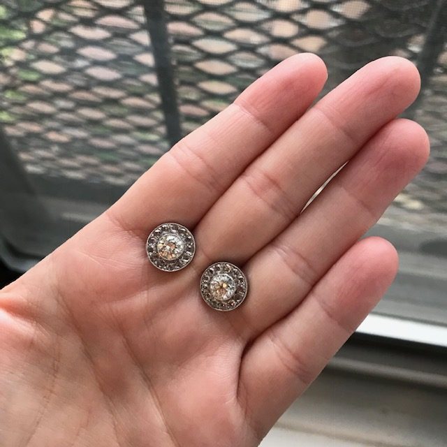 Diamond halo stud earring in a bezel setting
