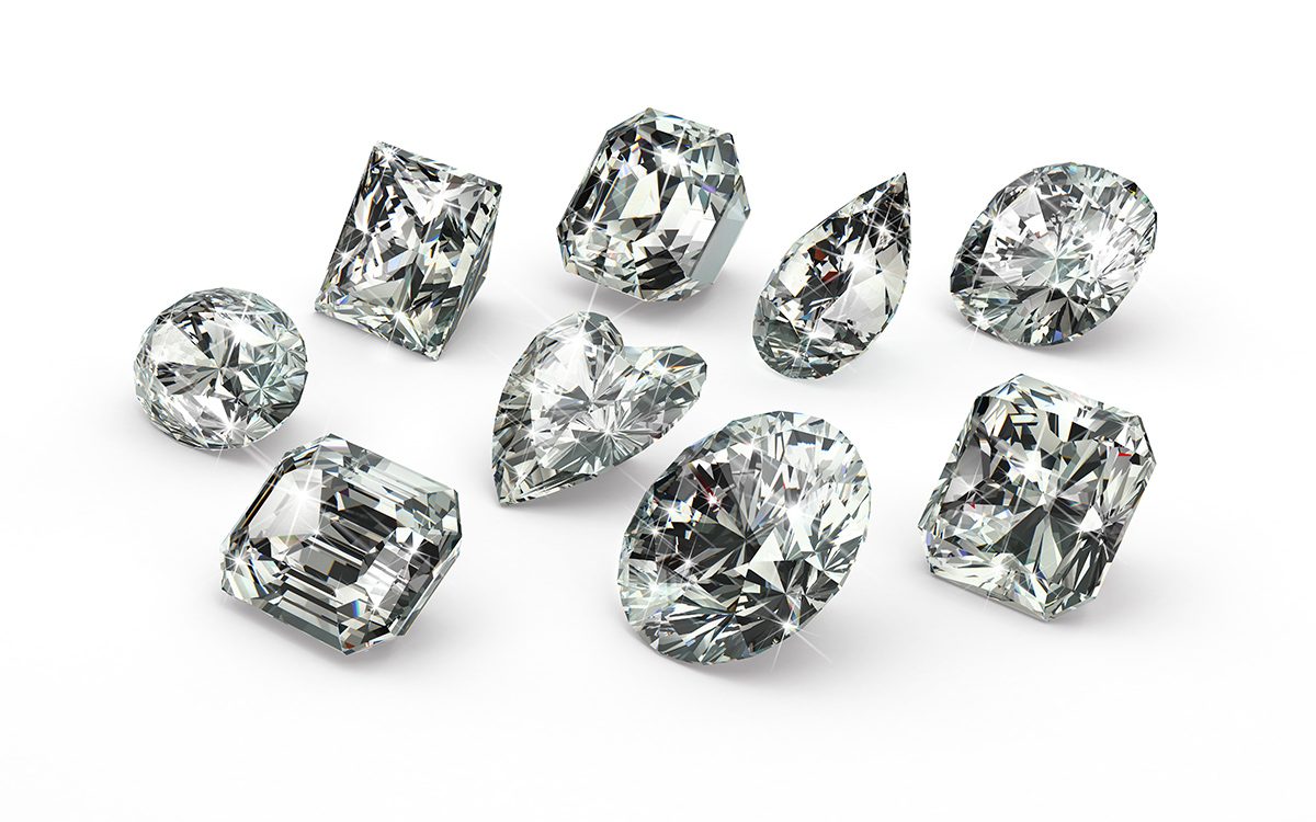 9 colorless diamonds of different cuts and shapes: round cuts, emerald cut, radiant cuts, pear shaped, and more.