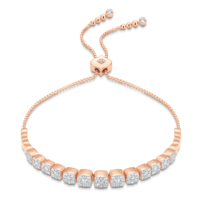 Clustered cushion cut diamond tennis bracelet in rose gold with diamond encrusted bolo closure