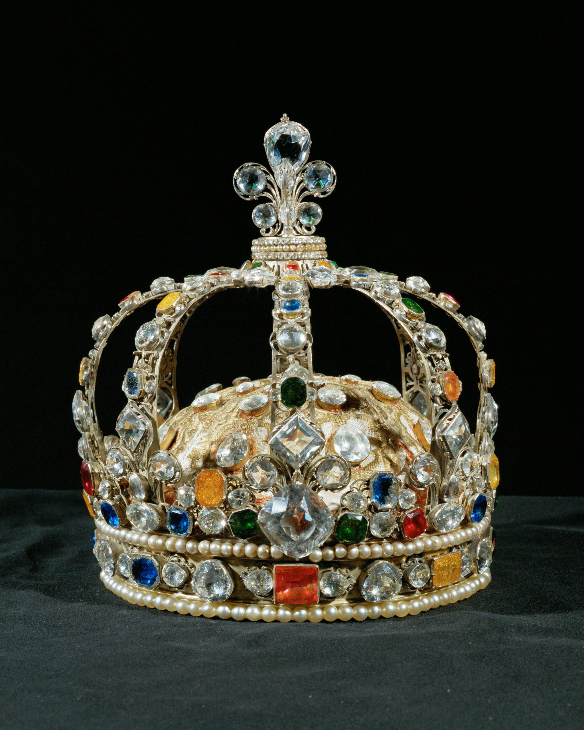 The Crown of Louis XV, embellished with Le Grand Mazarin diamond, sapphires, topazes, emeralds, rubies, and 2 rows of pearls