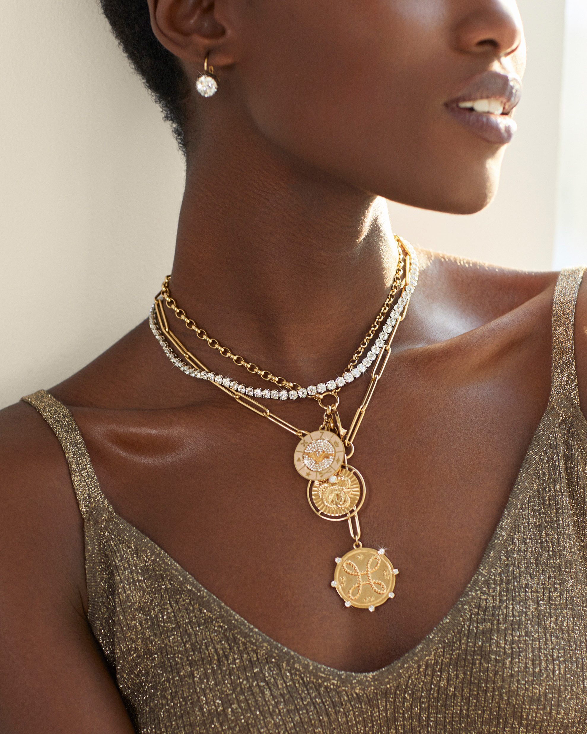 See our curation of three very different necklace layering looks, each featuring De Beers’s diamond rivière necklace