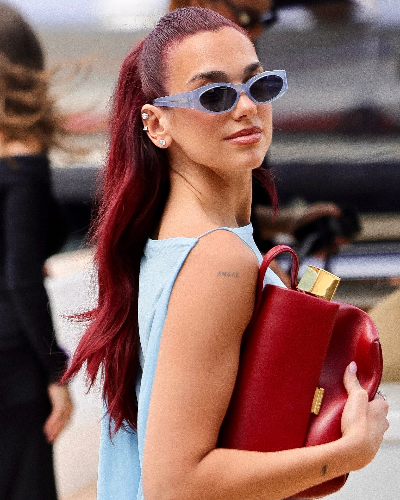 Dua Lipa's ears were stacked with Tiffany diamond stud earrings at the Jacquemus "La Casa" Cruise on June 10, 2024 in Capri, Italy. (Getty Images)