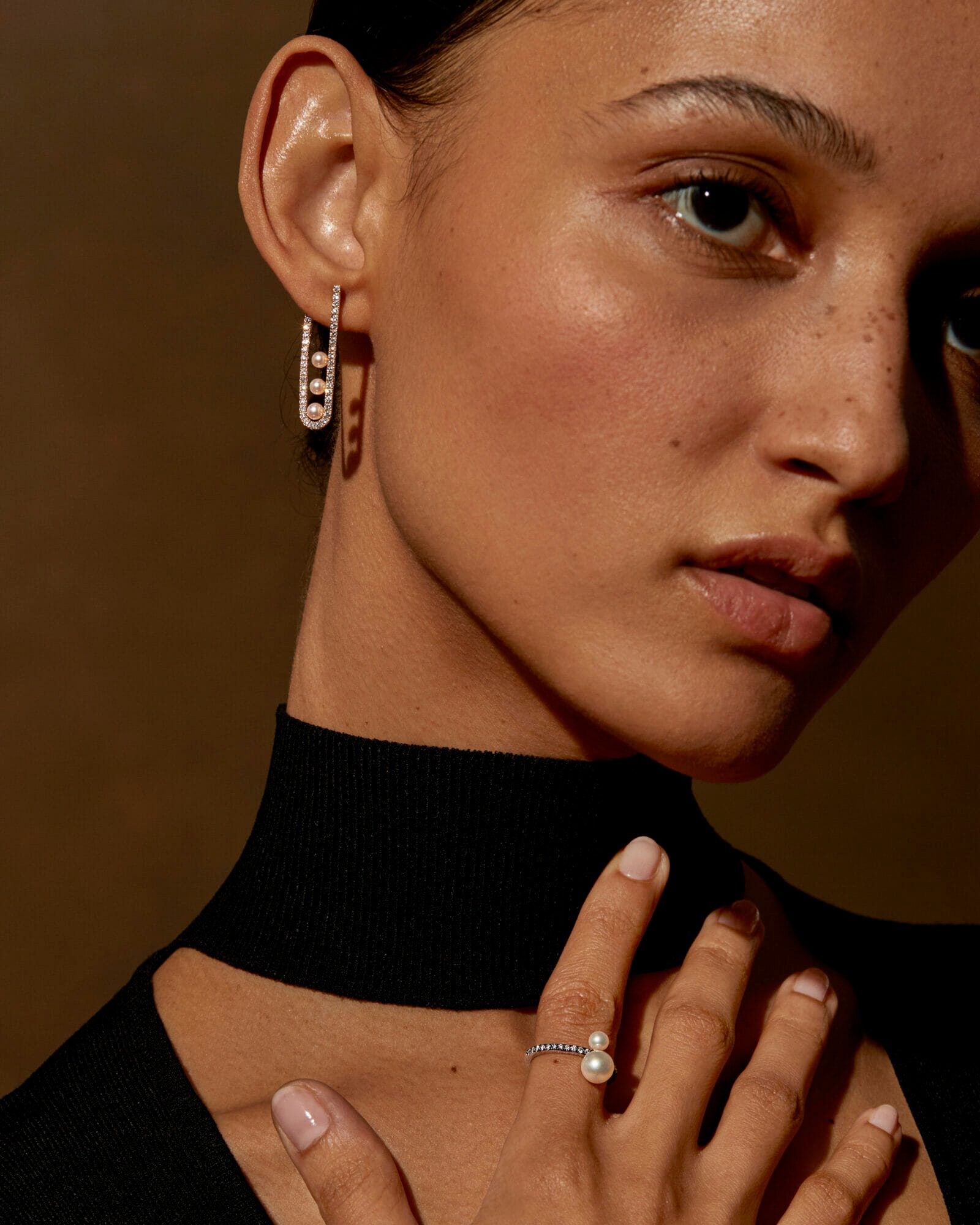 Diamonds and pearls, woman wearing earring and ring