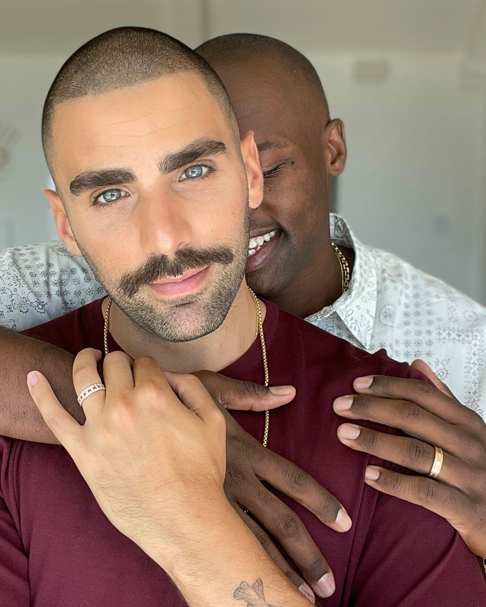 Phillip Picardi and Darien Sutton wearing jewelry