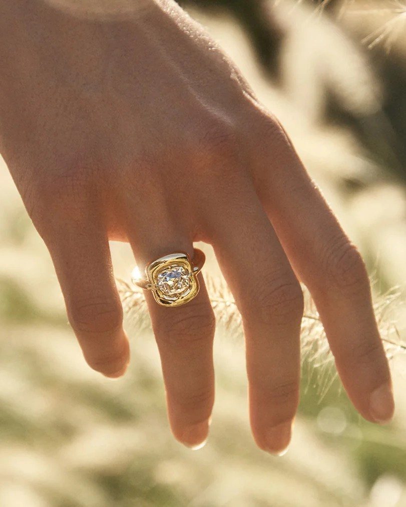 make an engagement ring look bigger