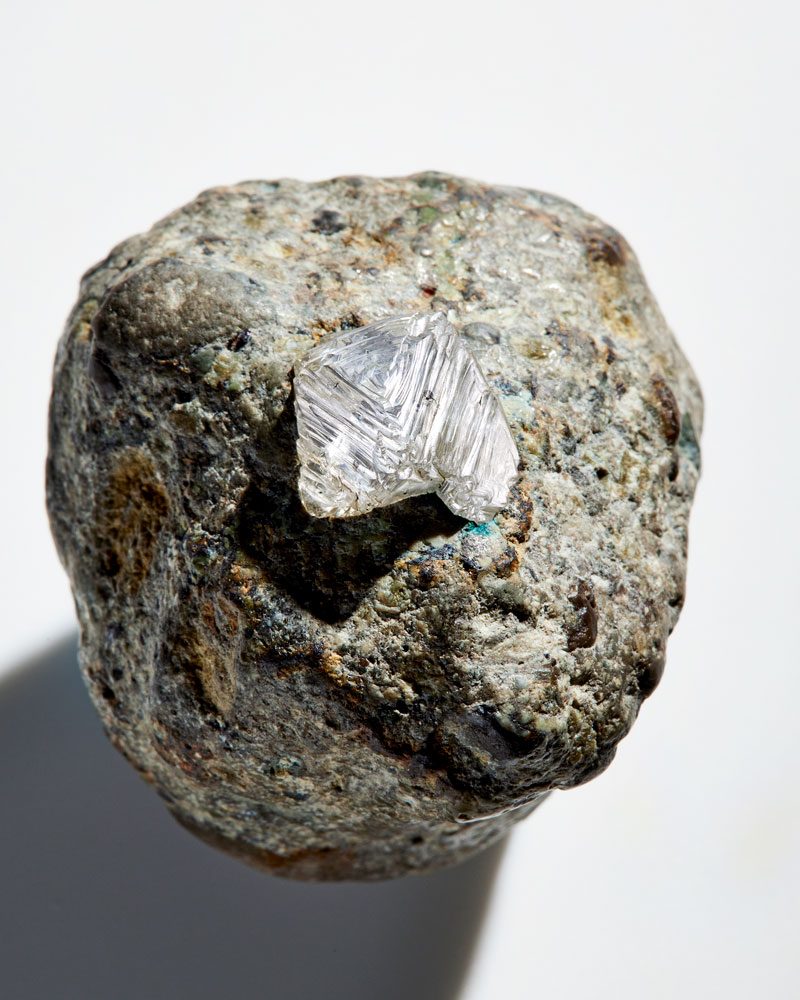 A natural diamond in the rough embedded in kimberlite, the volcanic rock that carried it from deep within the Earth to the surface.
