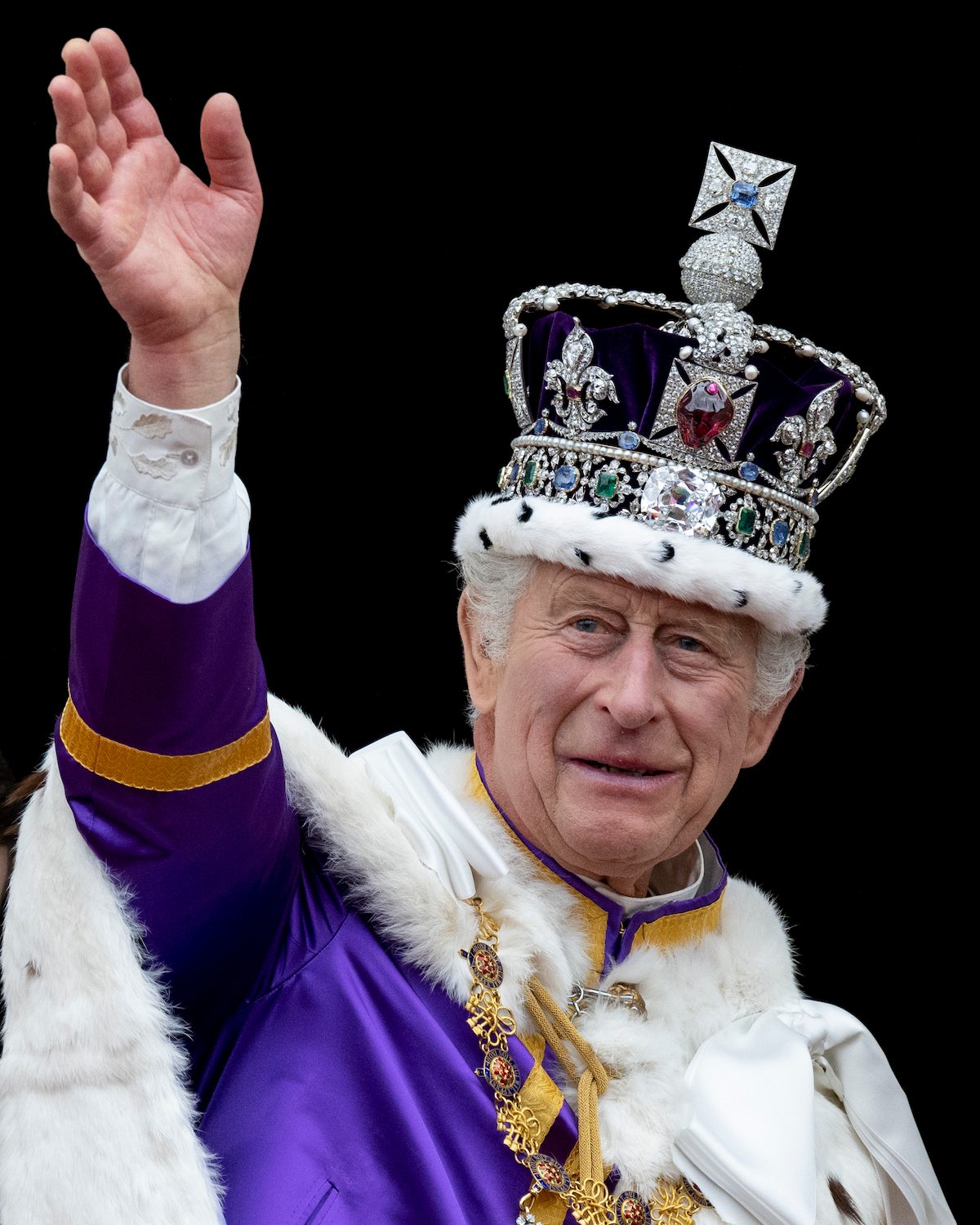 King Charles III wears the Imperial State Crown to wave from the balcony of Buckingham Palace during the Coronation of King Charles III and Queen Camilla on May 6, 2023, in London, England. (Getty Images)