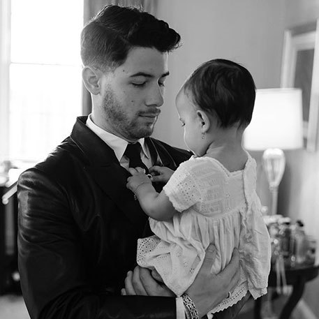 Nick Jonas with his daughter