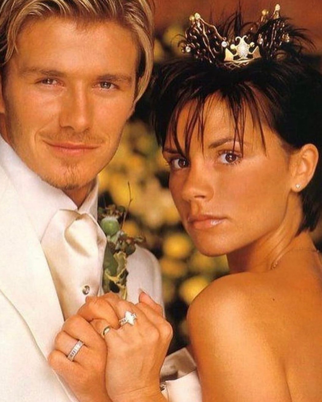 Soccer player David Beckham and singer from the "Spice Girls" Victoria Adams get married, 1999.