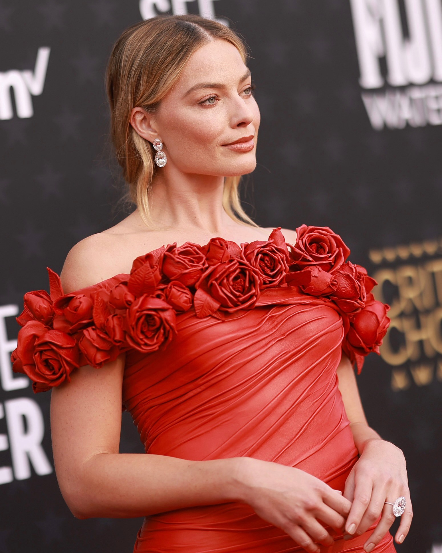 Margot Robbie attends 2024 Critics Choice Awards in Lorraine Schwartz diamonds.