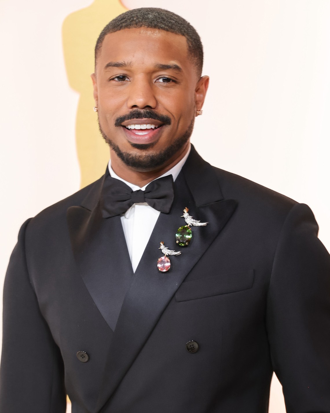 Oscars Jewelry: Michael B. Jordan wore two massive Tiffany & Co. diamond “Bird on a Rock” brooches at the 2023 Academy Awards
