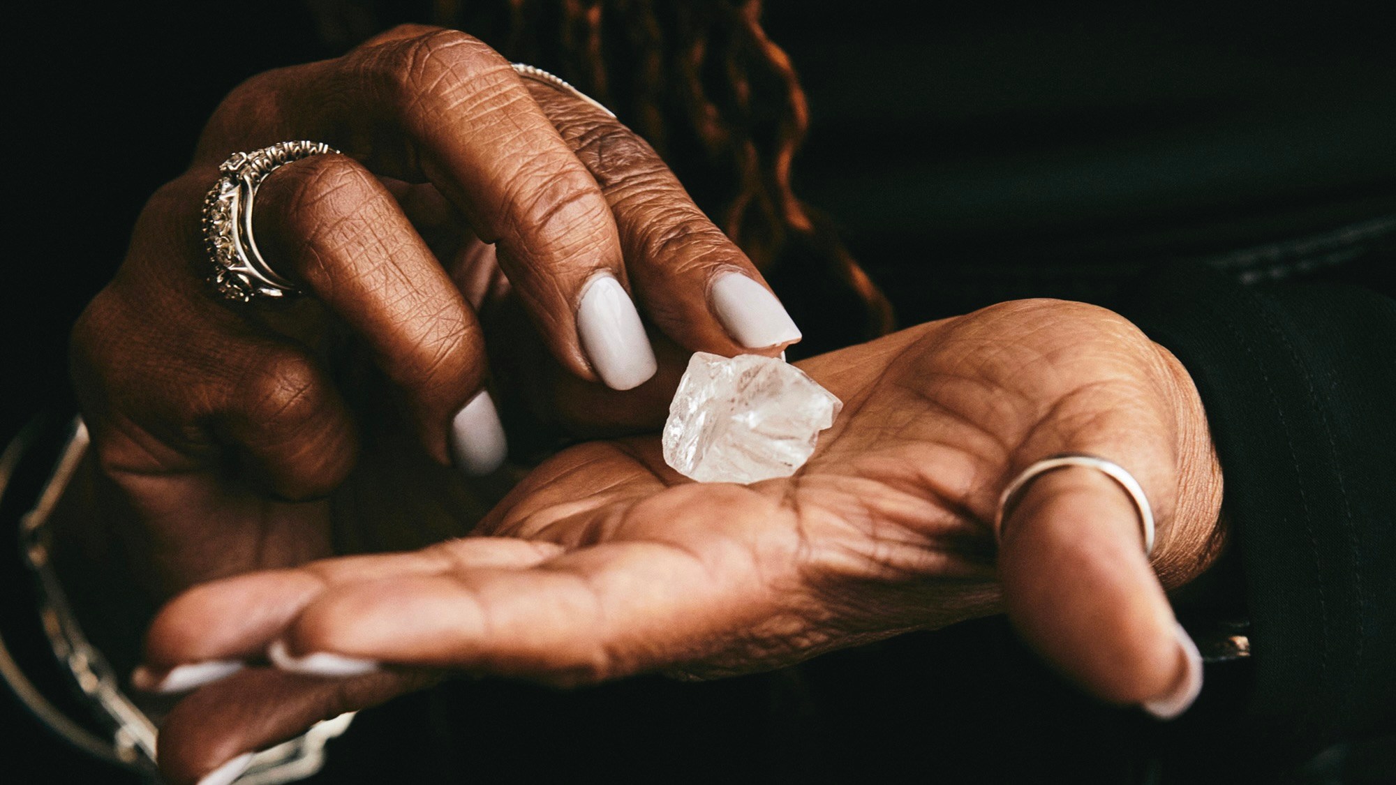 Woman Holding Rough Diamond in Botswana.(Photo by Molly SJ Lowe)