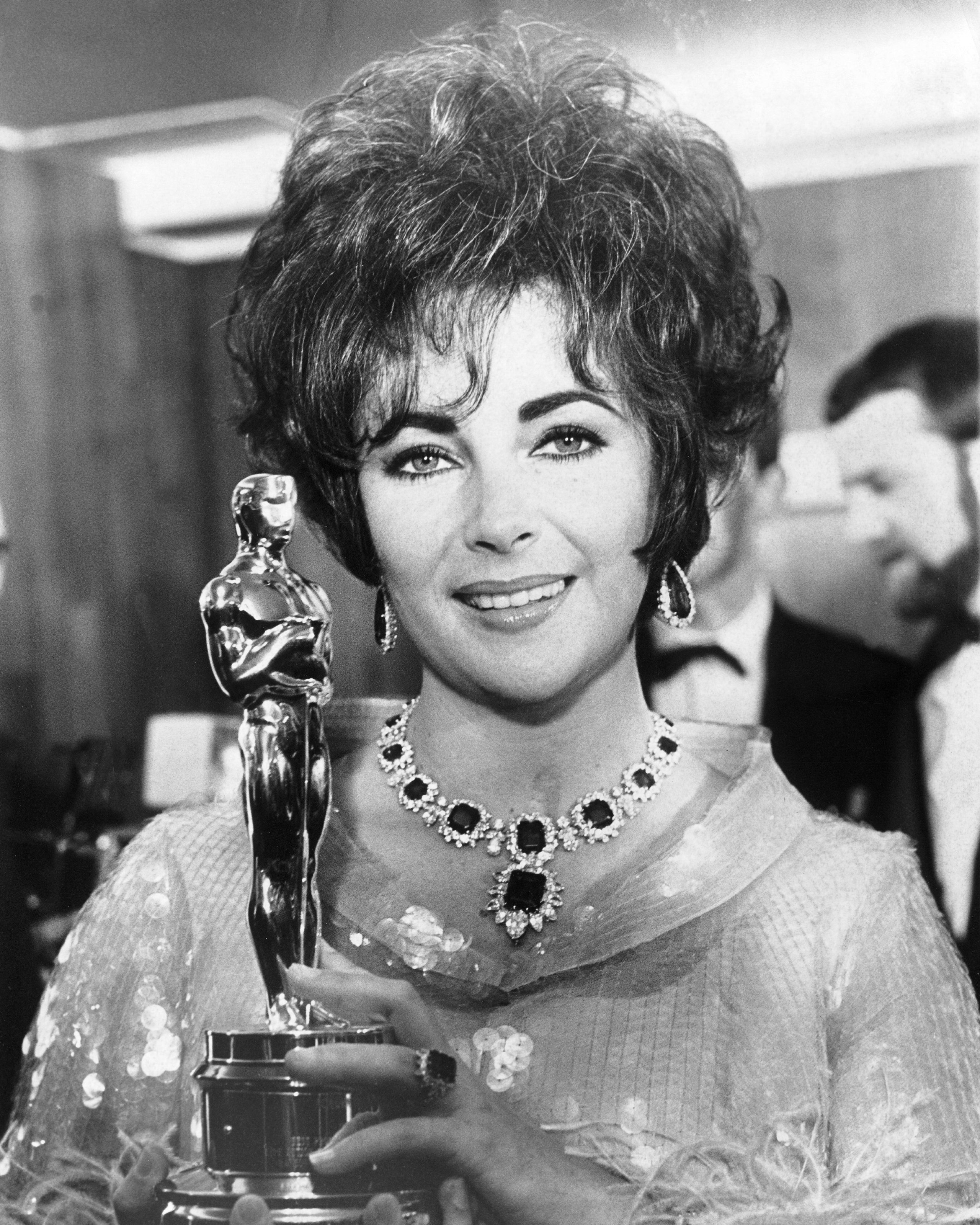 Elizabeth Taylor with her Best Actress Oscar for her role in the film Who's Afraid Of Virginia Woolf?, 1967 (Getty Images)