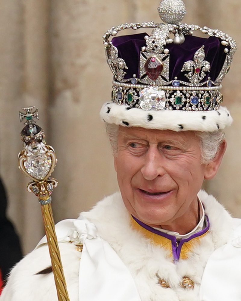 crown jewels of the united kingdom: King Charles III holding the Sovereign's Scepter with Cross