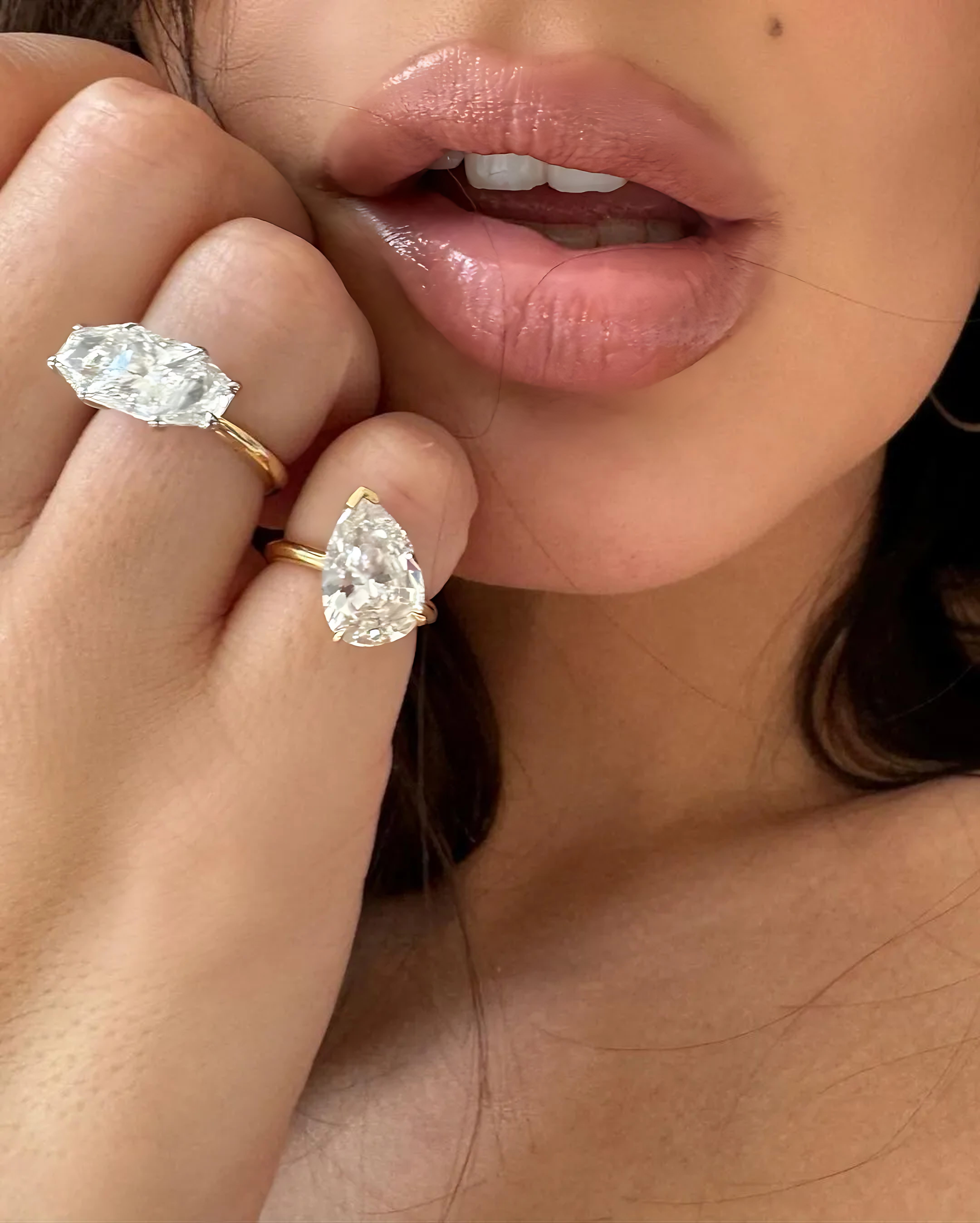 Emily Ratajkowski shows off her divorce rings, repurposing diamonds from her old toi et moi engagement ring, designed by Alison Chemla of Alison Lou. (Instagram: @emrata)