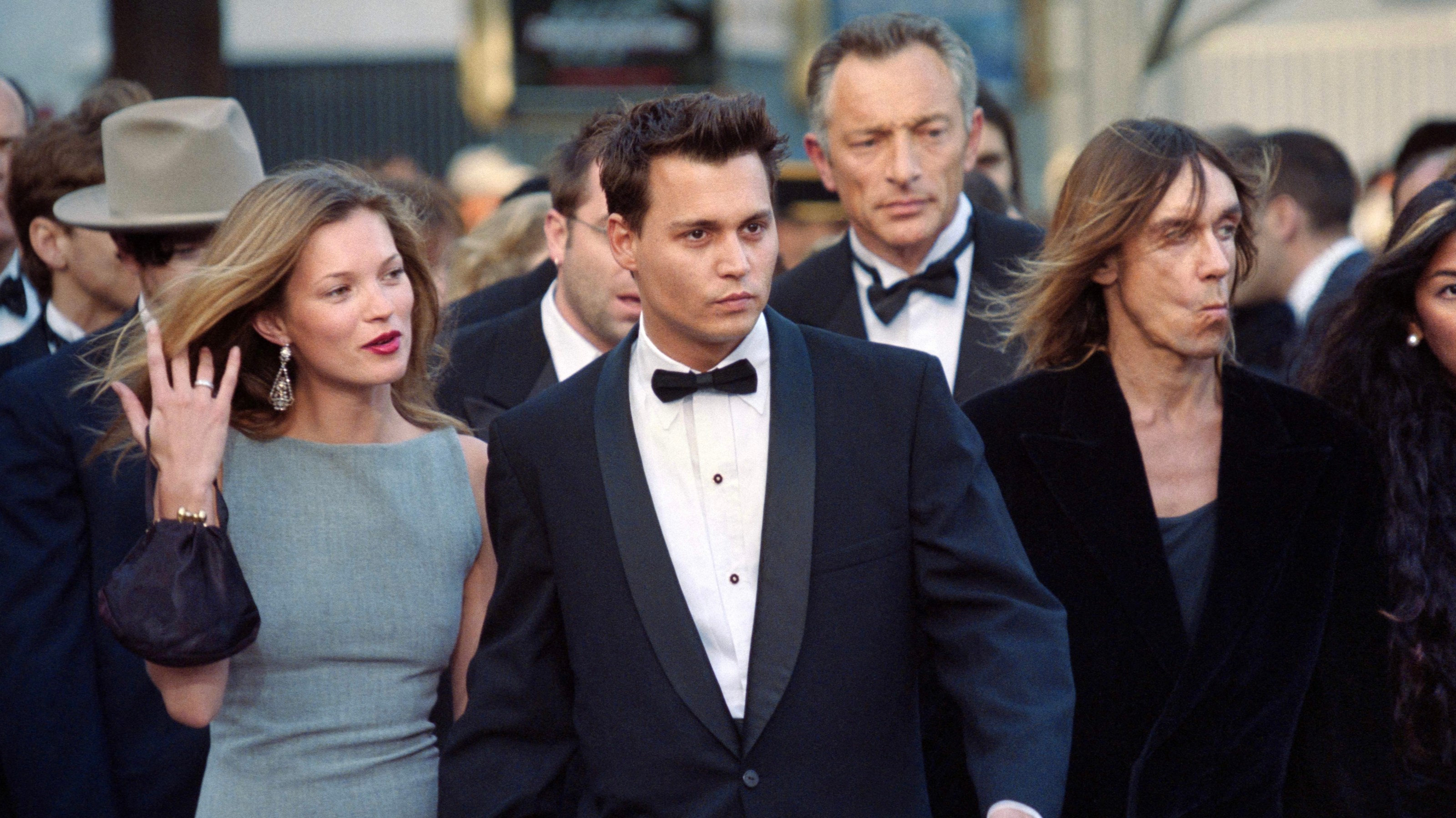 Kate Moss, Johnny Depp, and US singer Iggy Pop attend the screening of his film "The Brave" during the 50th Cannes Film Festival in Cannes, France, on May 10, 1997. (Getty Images)