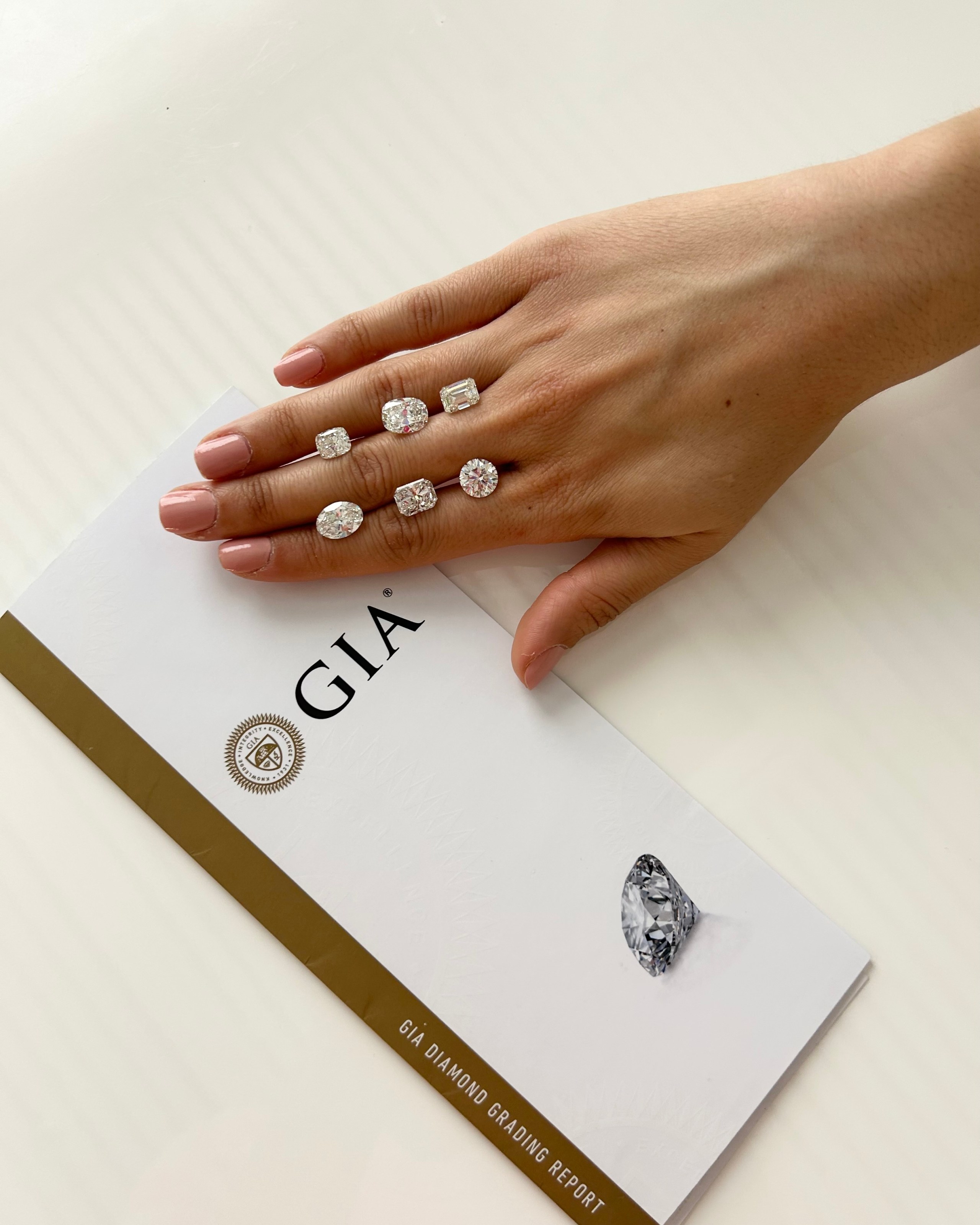 Diamonds Courtesy of The Clear Cut, Pictured with a GIA Diamond Grading Report (Only Natural Diamonds) Buy an Engagement Ring Online Shopping for a Diamond 
