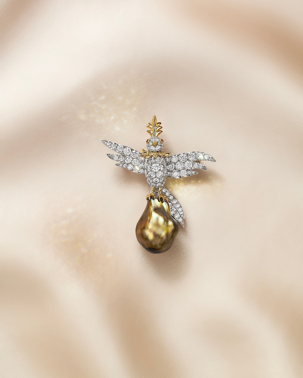 Bird on a Pearl brooch with a 20-carat yellowish-brown baroque natural saltwater pearl,fancy yellow diamonds, white diamonds and rubies. (Courtesy of Tiffany & Co.)