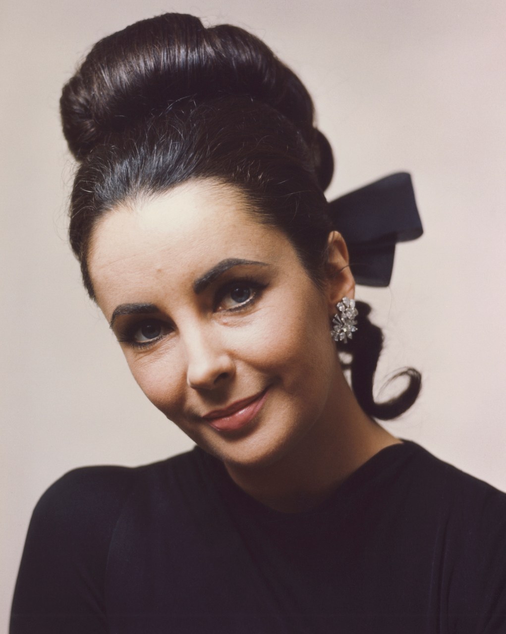 Elizabeth Taylor 1960's publicity portrait in black dress, circa 1965. (Photo by Screen Archives/Getty Images)