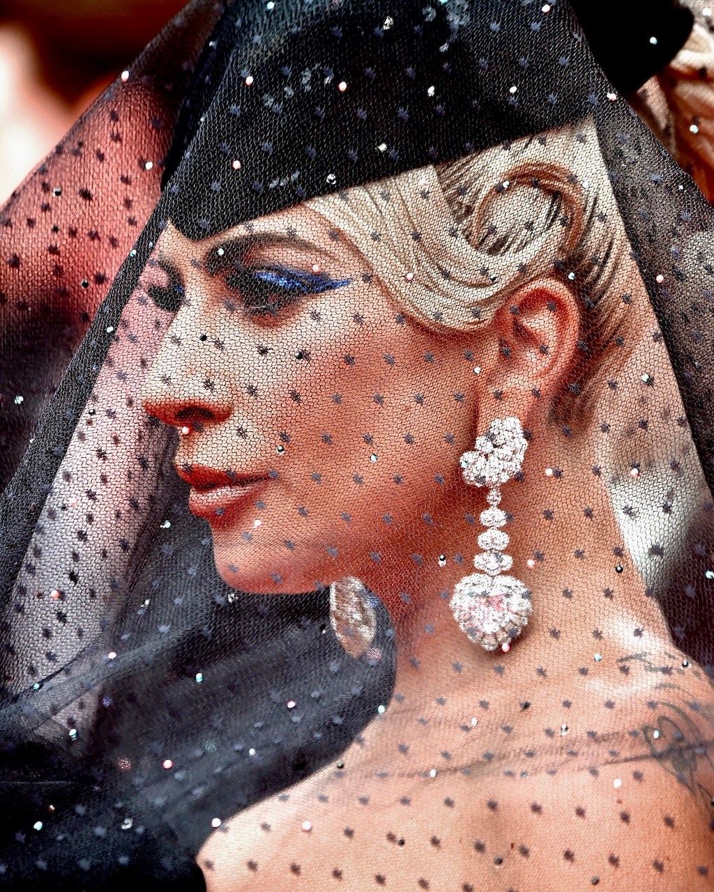 Lady Gaga mismatched earrings