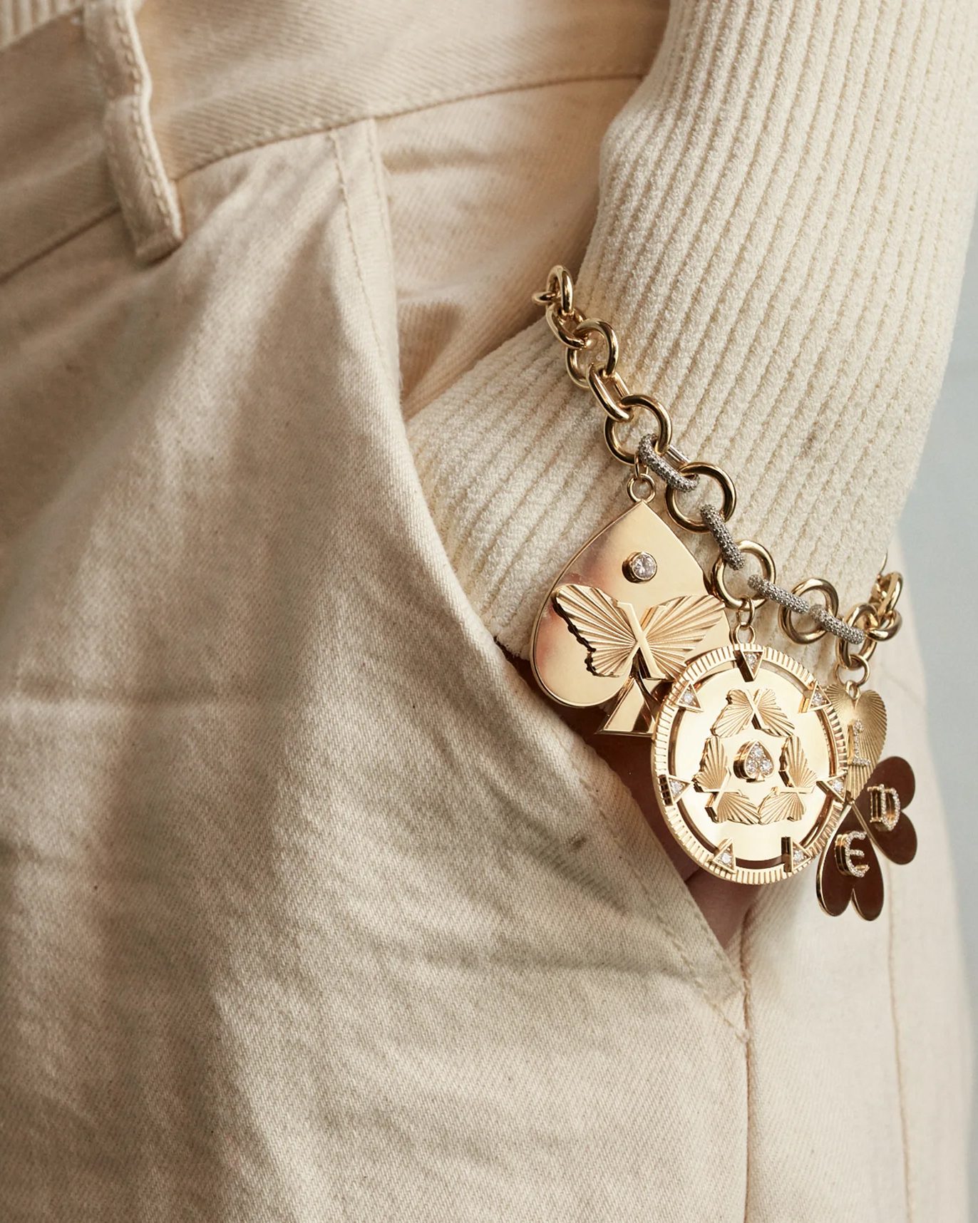 diamond charms on a charm bracelet