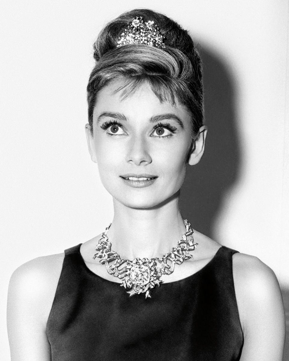 Famous Movie Jewelry: Audrey Hepburn, before filming Breakfast At Tiffany's, wears the store's most expensive diamond necklace, including the Tiffany Diamond. (Getty Images)