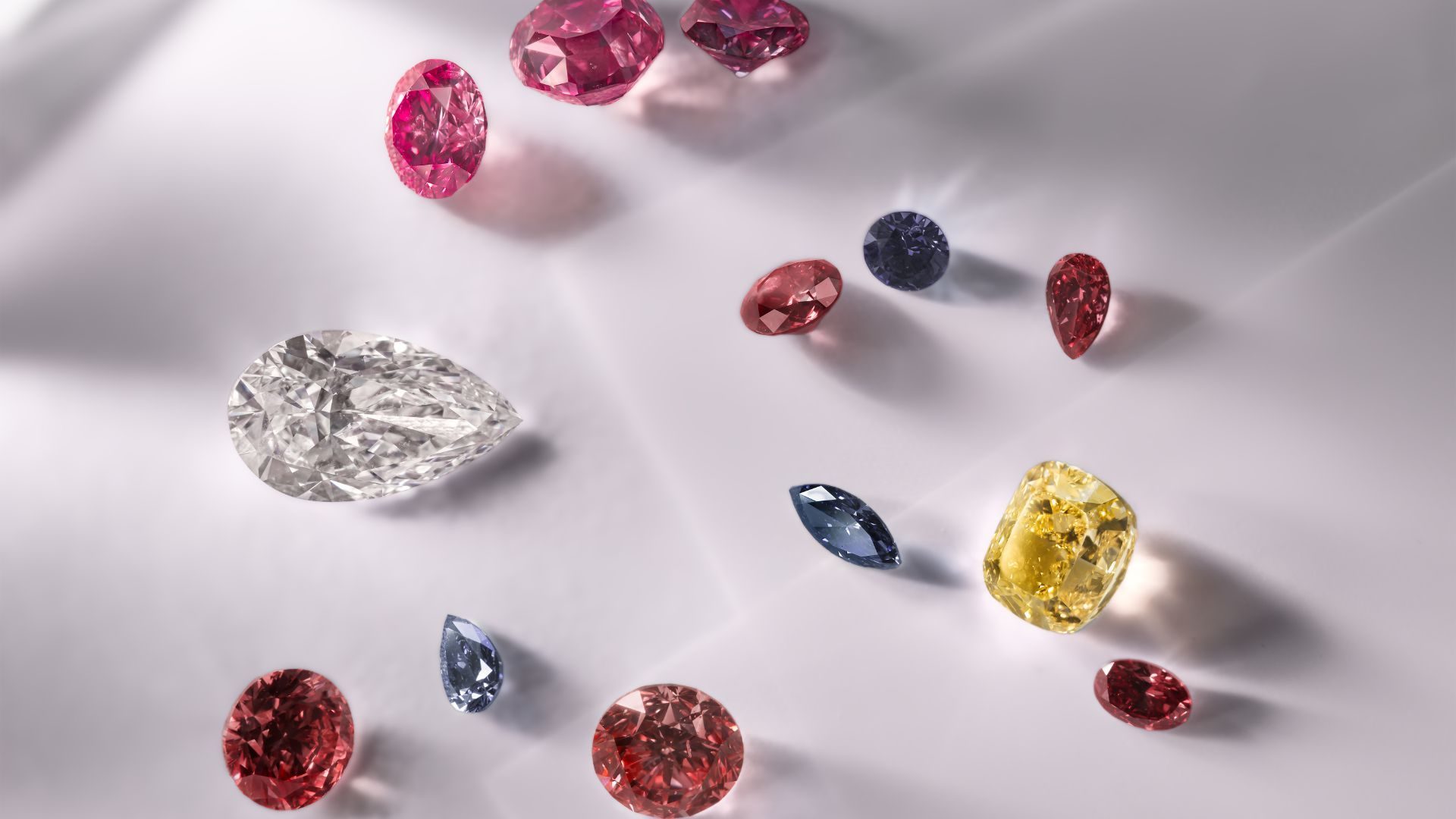 A selection of Argyle diamonds from the new Beyond Rare tender comprising a unique combination of pink, red, violet, yellow and white polished diamonds, embodying “rarity within rarity." (Argyle Diamonds Pty Limited 2024)
