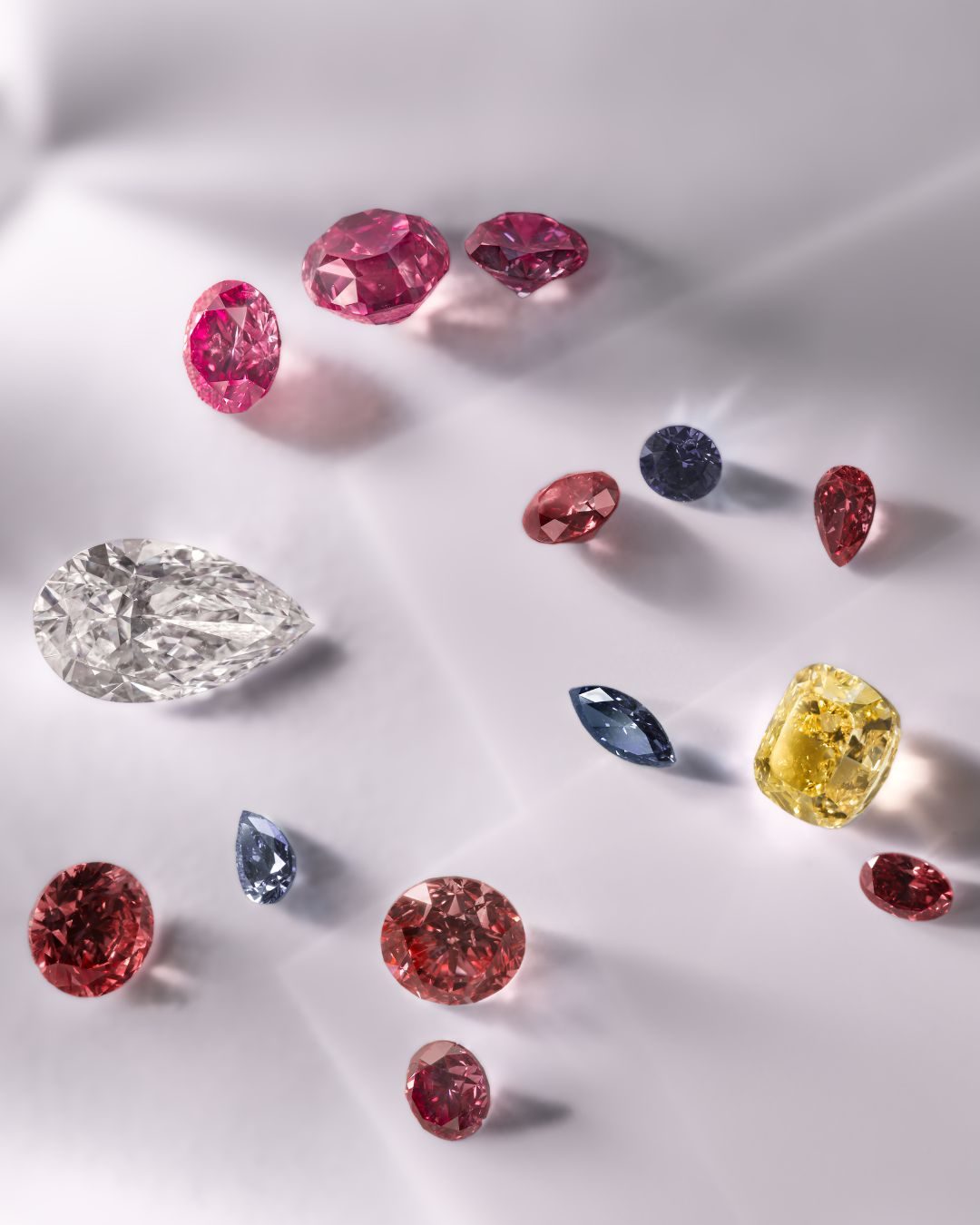 A selection of Argyle diamonds from the new Beyond Rare tender comprising a unique combination of pink, red, violet, yellow and white polished diamonds, embodying “rarity within rarity." (Argyle Diamonds Pty Limited 2024)