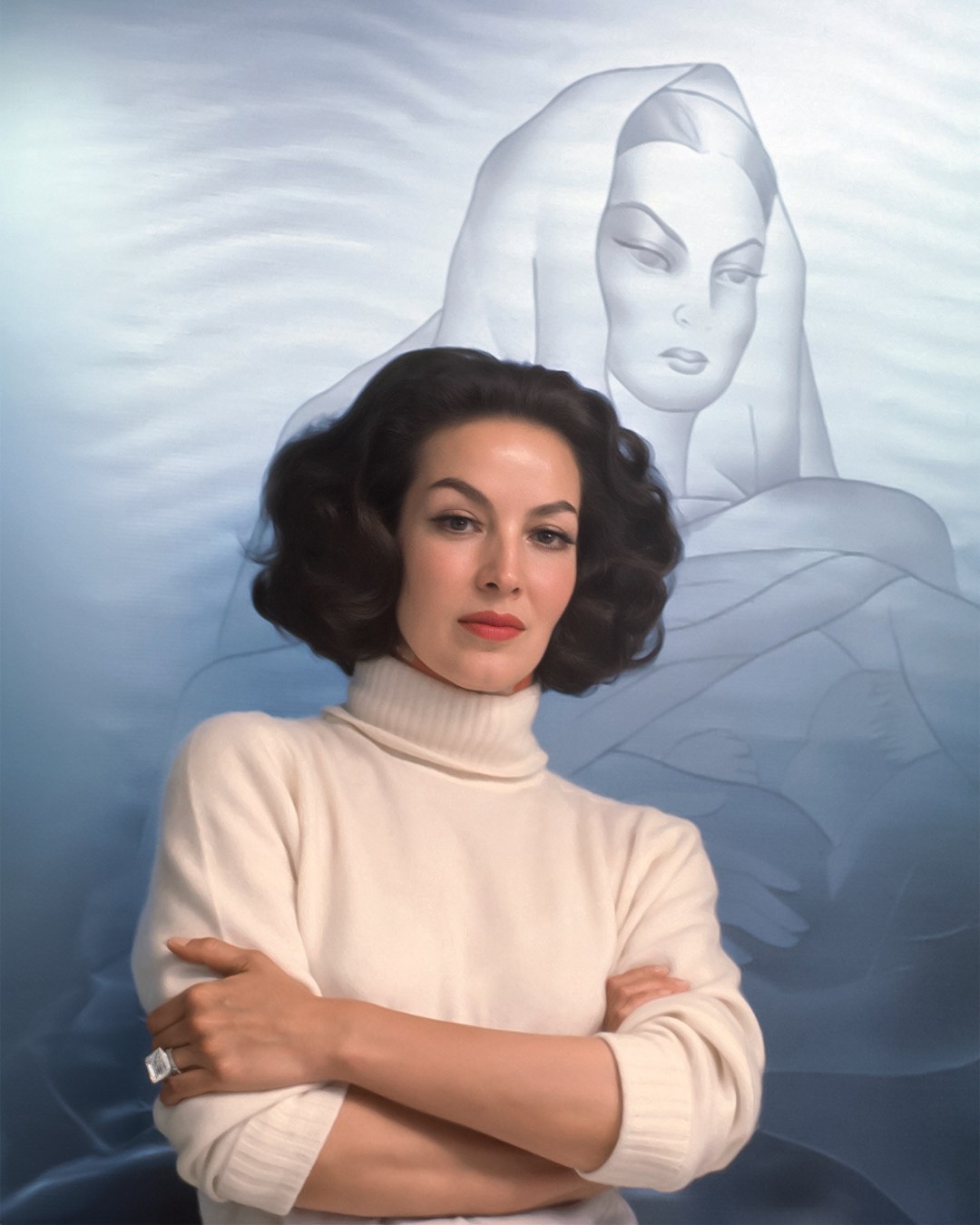 Mexican actress María Félix poses with a portrait by Diego Rivera while wearing the original 41.37-carat Ashoka diamond from William Goldberg.