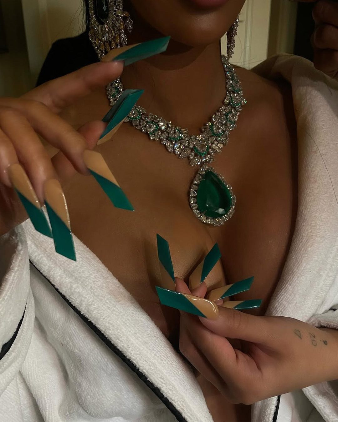 Cardi B wearing Kamyen jewellery with emerald and diamond pieces at the MET Gala.