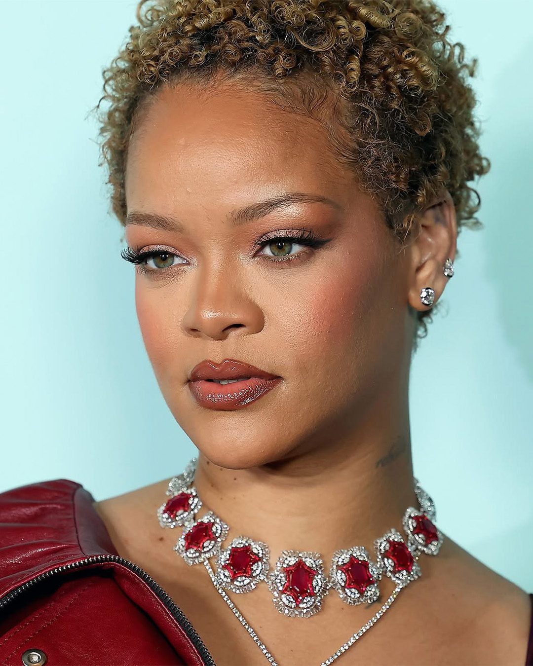 Rihanna wearing a ruby and diamond choker by Manish Malhotra at the Fenty Hair launch.