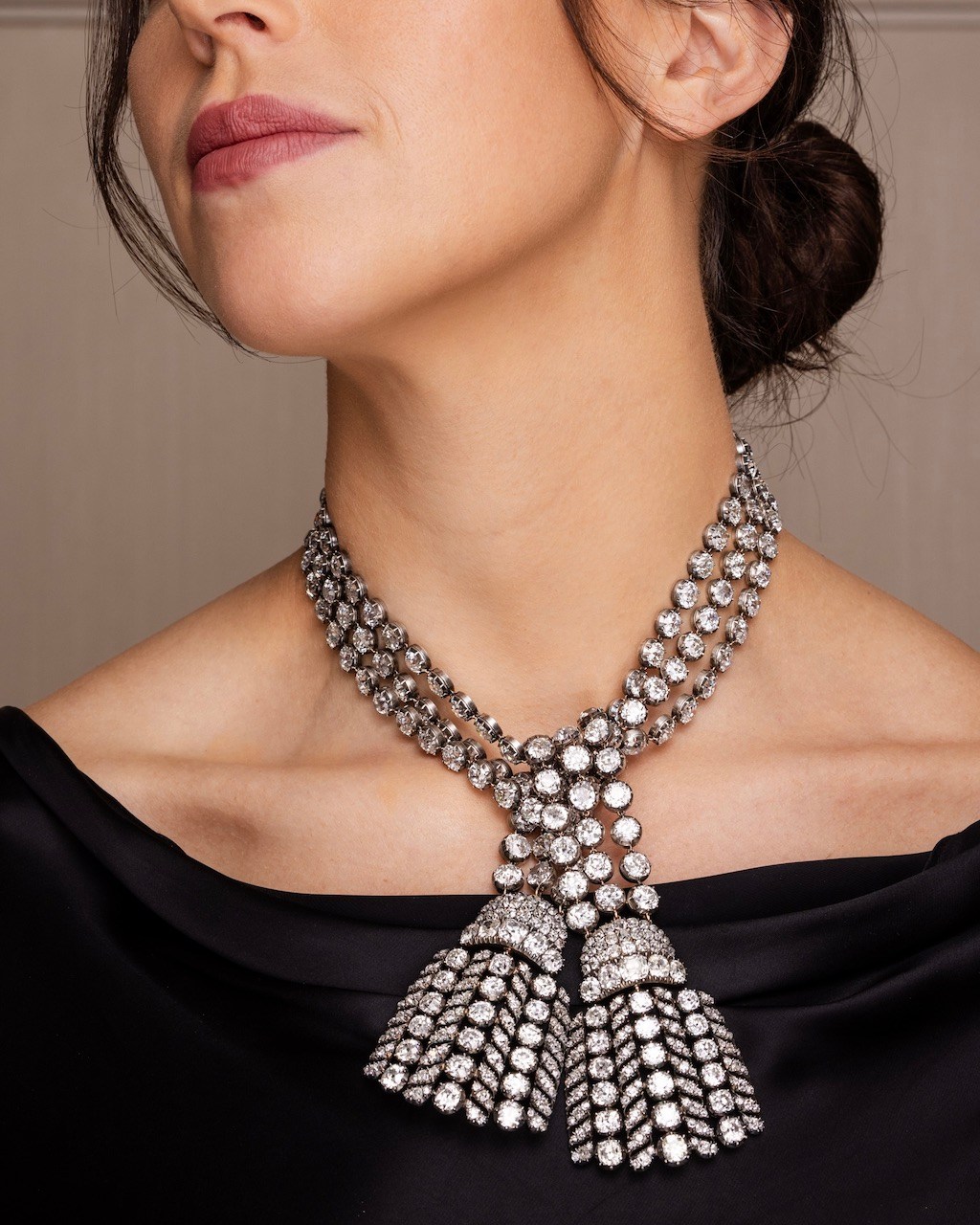 Model wearing a diamond tassel necklace