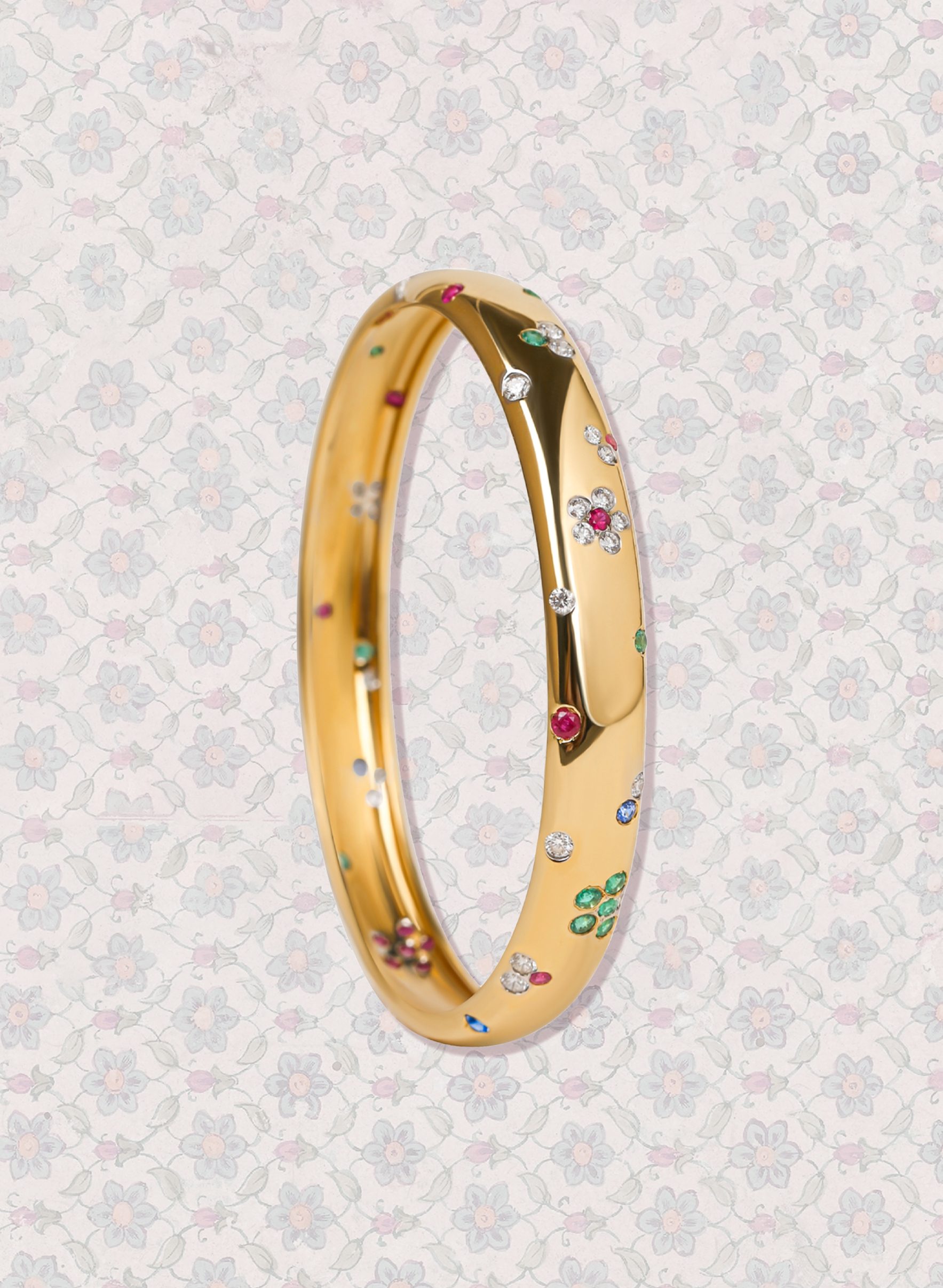 Floral earrings and bangle with diamonds, rubies, and emeralds