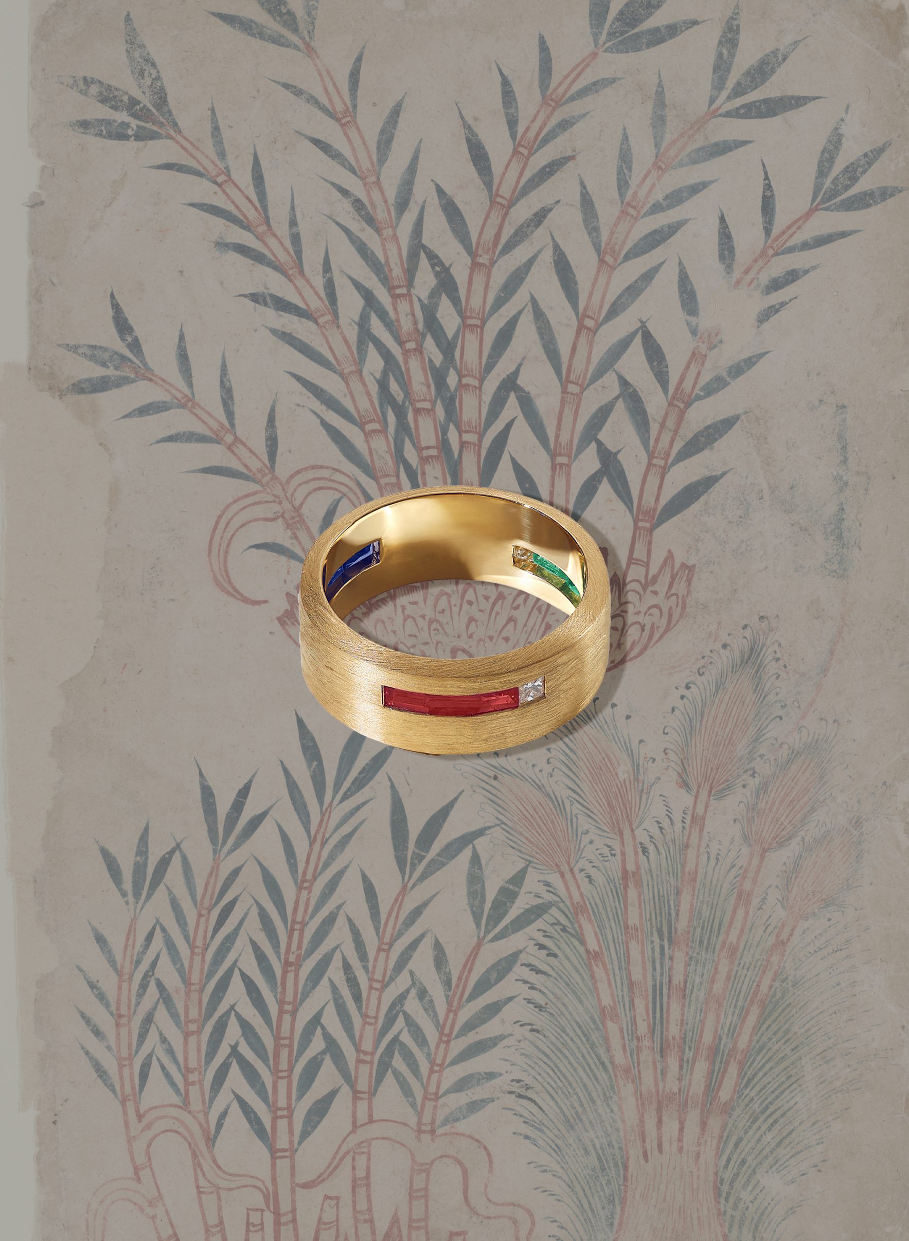 Custom engagement ring by Andal Atelier with rubies, emeralds, and gemstones