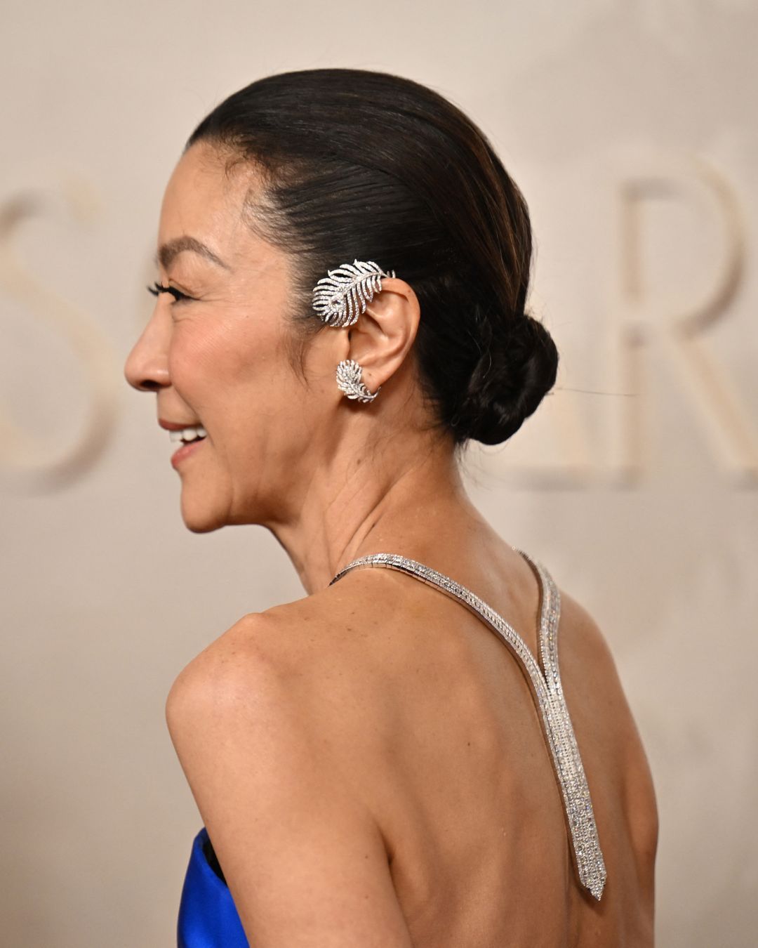Michelle Yeoh wore a Boucheron Plume de Paon diamond earscape at the 2025 Oscars.