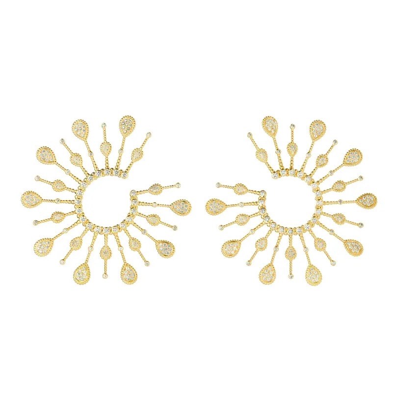 Boucheron Serpent Bohème Solarité Multi-motif Hoop Earrings, $56,400, boucheron.com