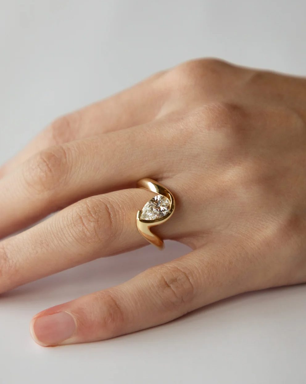 yellow gold engagement rings: yellow gold engagement ring with pear shaped diamond
