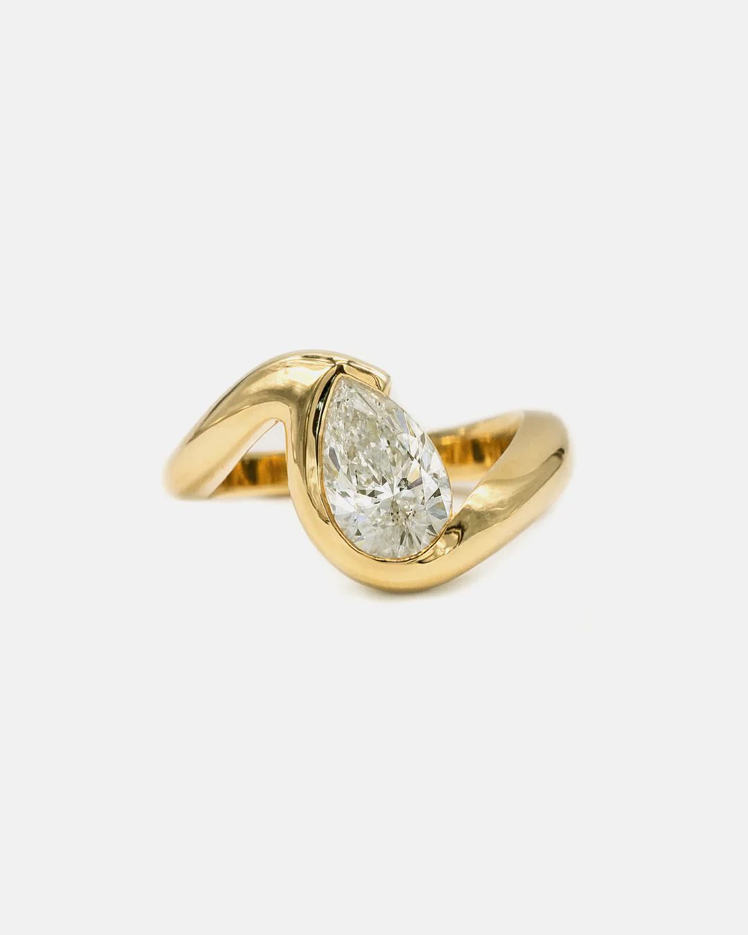 yellow gold engagement rings: yellow gold engagement ring with pear shaped diamond