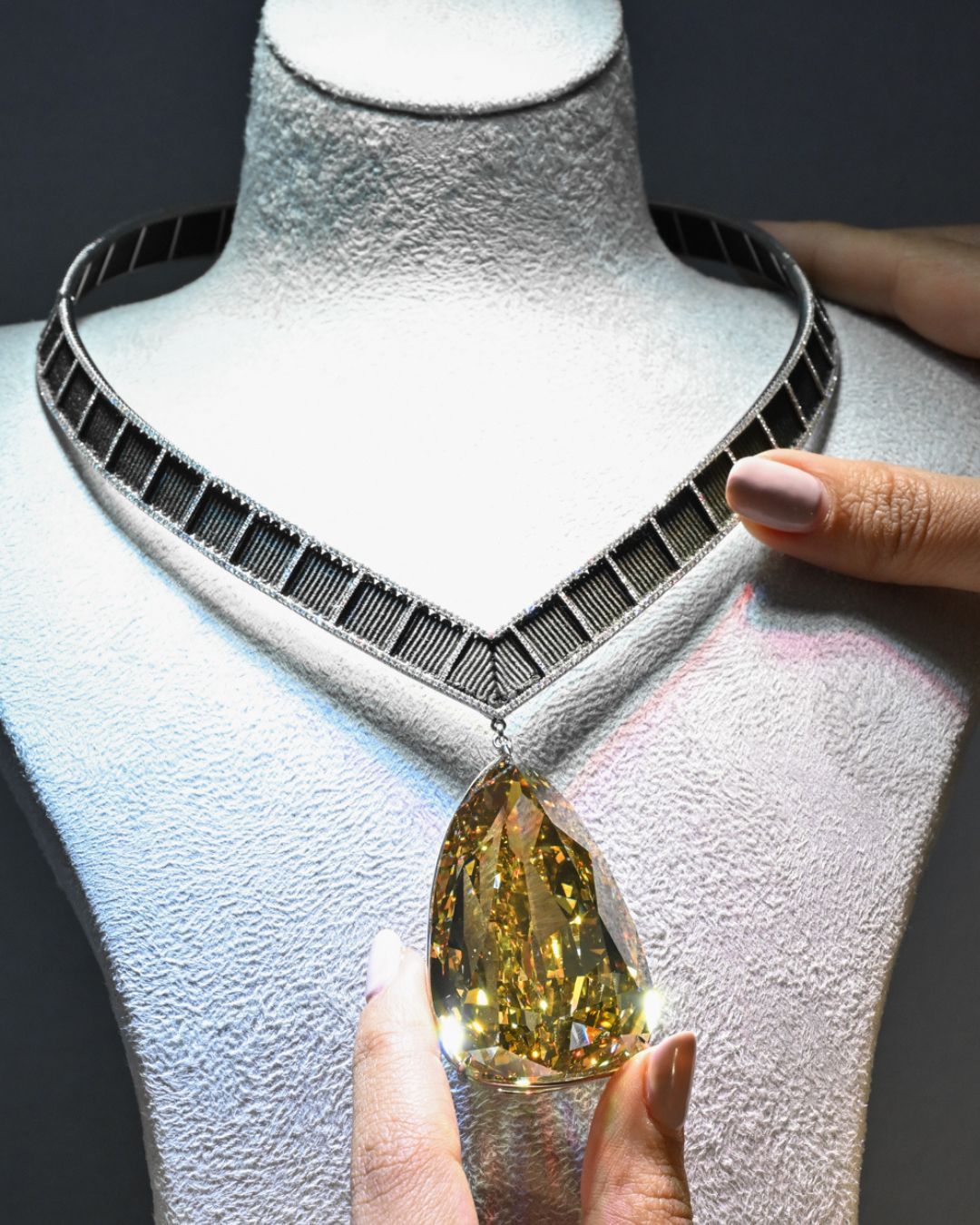 The Golden Canary Necklace 303.10 carat pear shaped Fancy Deep Brownish Yellow Diamond, Internally Flawless clarity will be featured at Sotheby's Abu Dhabi exhibition.