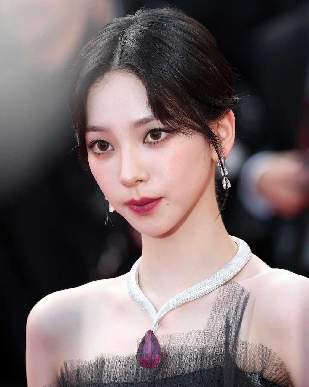 Karina, member of the South Korean K-pop girl group, aespa, attends the Cannes Film Festival, wearing a diamond and rubellite Chopard necklace