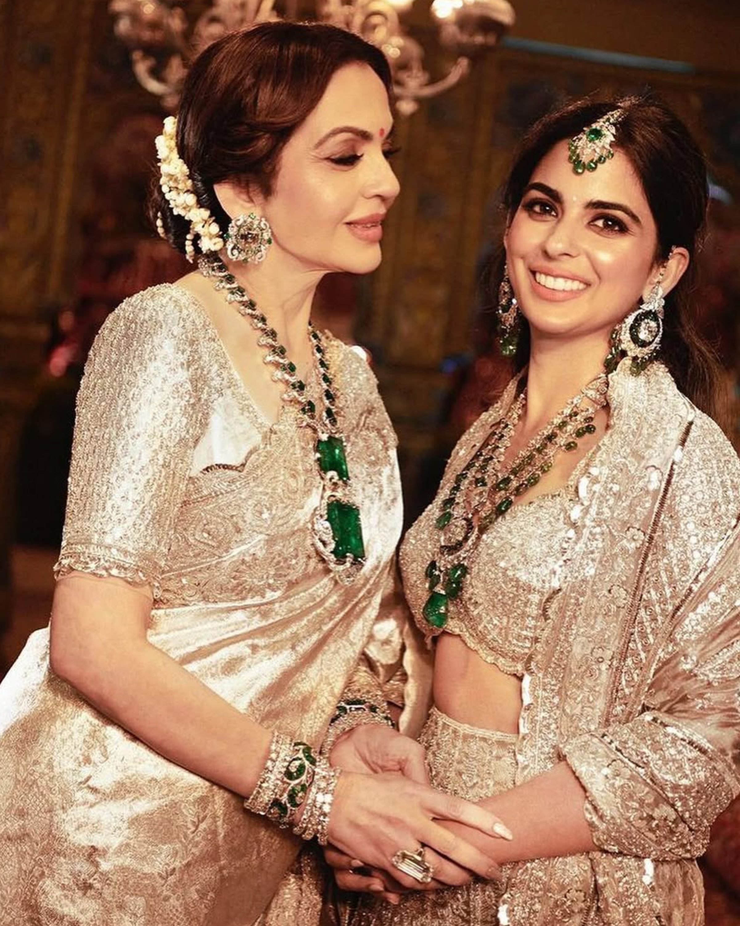 Isha Ambani in natural diamond and emerald necklace, earrings, maang tikka, and bracelet