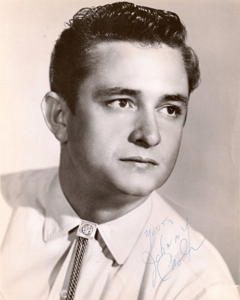 Country singer Johnny Cash wearing a diamond bolo tie in a promotional photo for Sun Records, 1955. (Wikimedia Commons / Public Domain)