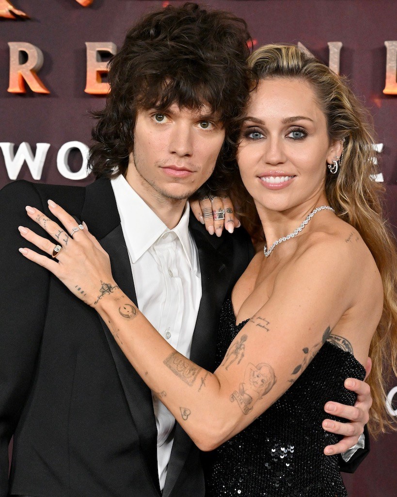 Maxx Morando and Miley Cyrus announce their engagement with her new Jacquie Aiche cushion-cut diamond engagement ring at the premiere of "Avatar: Fire and Ash" on December 01, 2025 in Hollywood. (Getty Images)