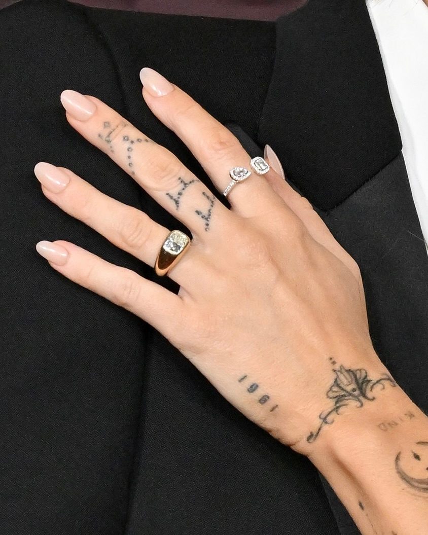 Miley Cyrus's Jacquie Aiche cushion-cut diamond engagement ring detail as seen at the premiere of "Avatar: Fire and Ash" on December 01, 2025 in Hollywood. (Getty Images)