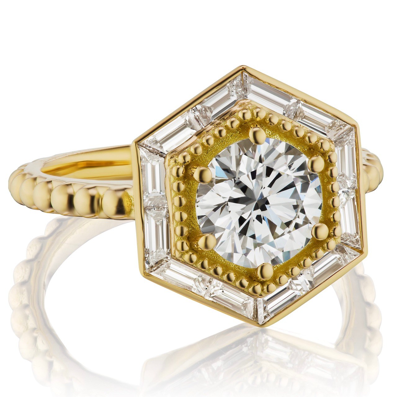 Lauren Harwell Godfrey reset her round diamond in 18-karat yellow gold with a hexagonal halo of baguette-cut diamonds on a beaded band. (Courtesy of Lauren Harwell Godfrey)