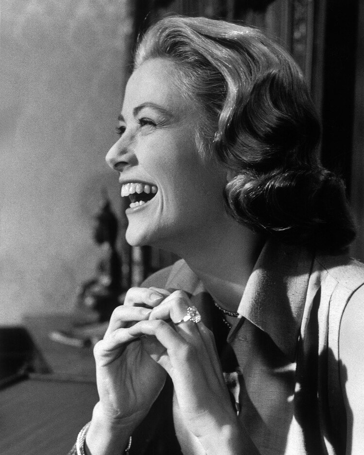 Grace Kelly wears her Cartier 10.48-carat emerald-cut diamond engagement ring from Prince Rainier III of Monaco. (Courtesy of Cartier)