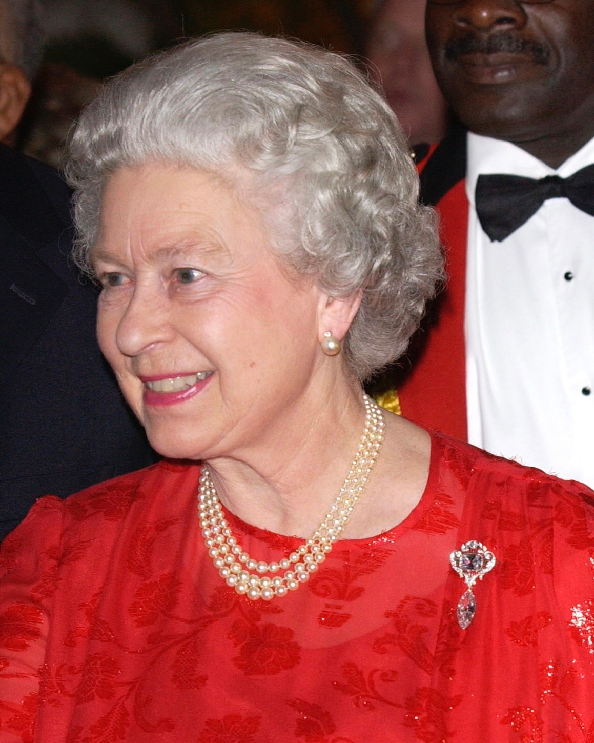 Queen Elizabeth II wears the Cullinan VIII (cushion-cut diamond) and the Cullinan VI (marquise pendant) and the VIII (cushion-cut diamond) while attending a reception. (Getty Images)