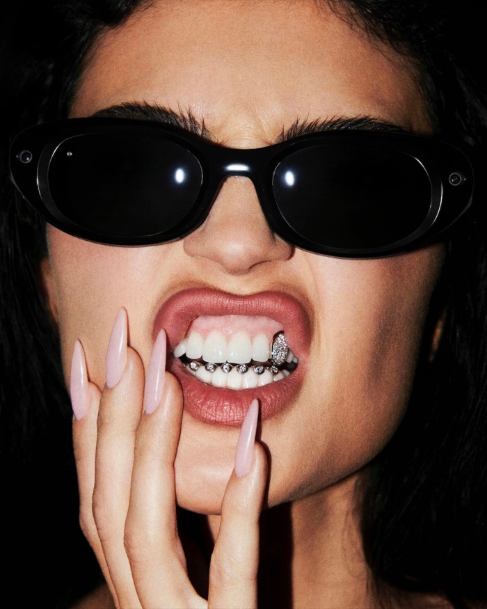 Kylie Jenner wears diamond grillz while promoting Meta Glasses