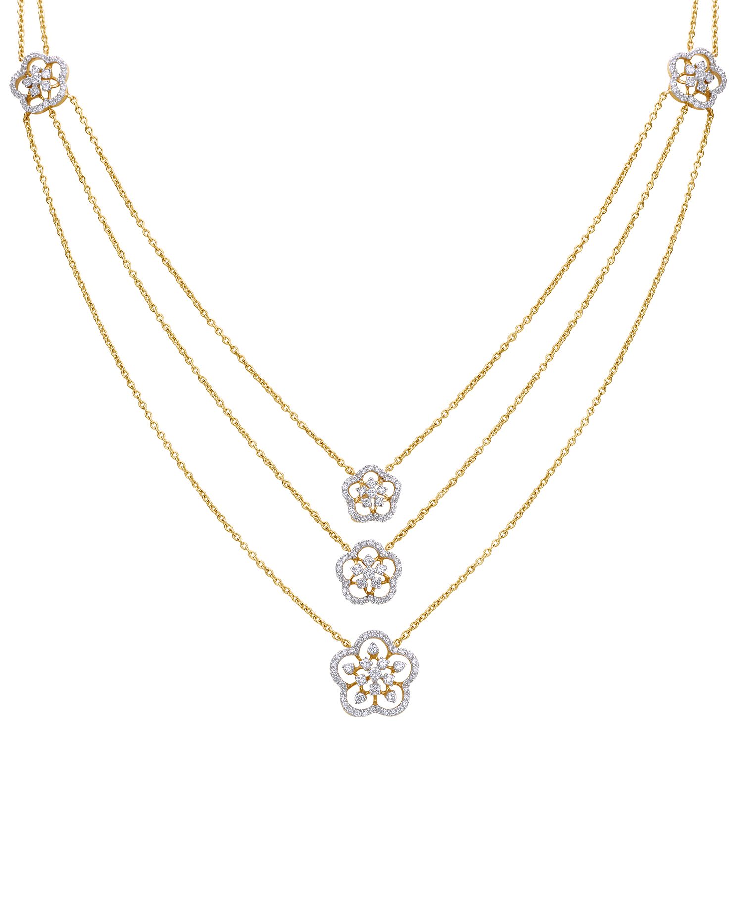 Three-layer diamond necklace with floral charms.